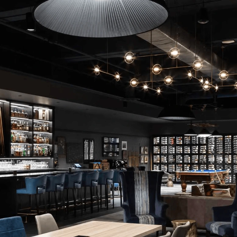 Commercial tenant improvement electrical work with modern lighting, bar setup, and power systems for restaurant space in Vancouver