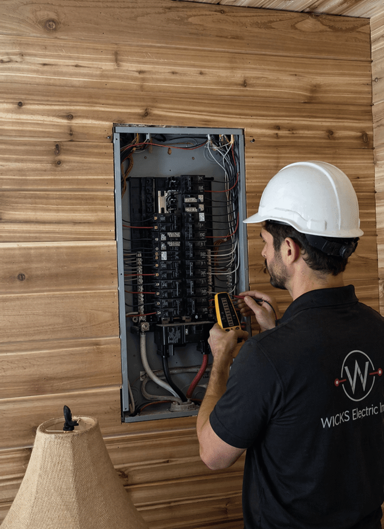 residential-electrical-panel-inspection-vancouver (1) Licensed electrician performing a residential electrical panel inspection and testing circuit breakers in a Vancouver home